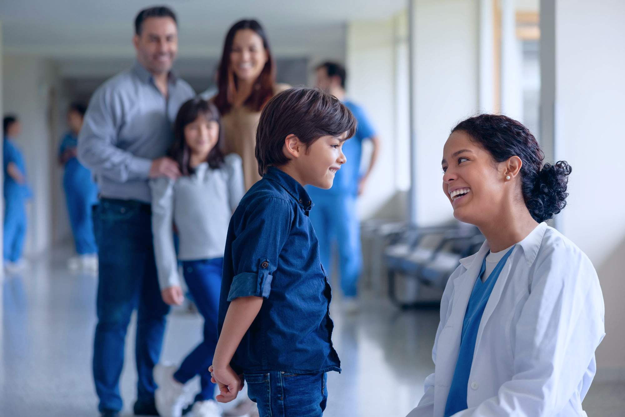 Doctor talking with child patient.